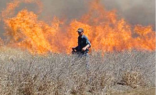 Comet rural firefighters conduct a hazard reduction burn near the Capricorn Highway in 2010. Comet rural firefighters conduct a hazard reduction burn near the Capricorn Highway in 2010.